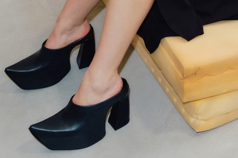 marko bakovic woman heels tights body laying down sofa mules boots