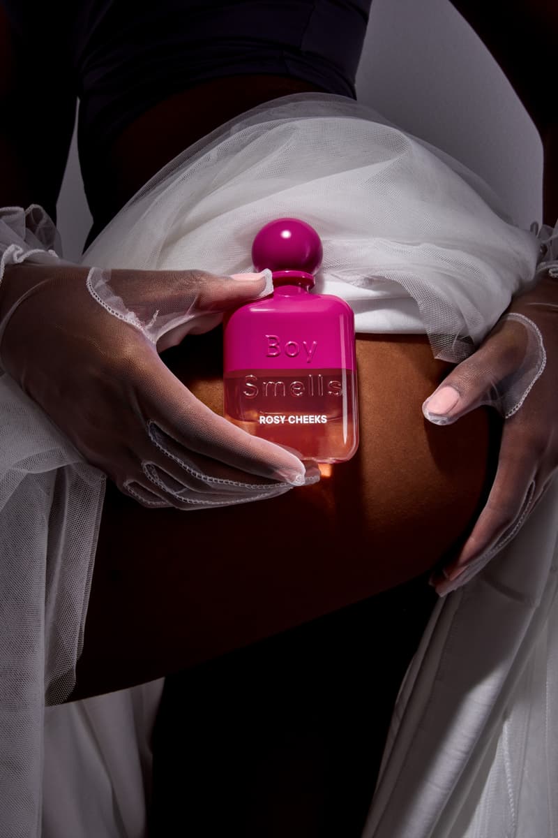 woman holding boy smells fragrance in white skirt, new rebrand, candles, beauty