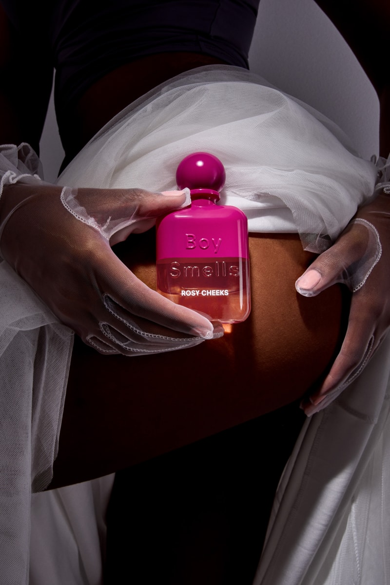 woman holding boy smells fragrance in white skirt, new rebrand, candles, beauty