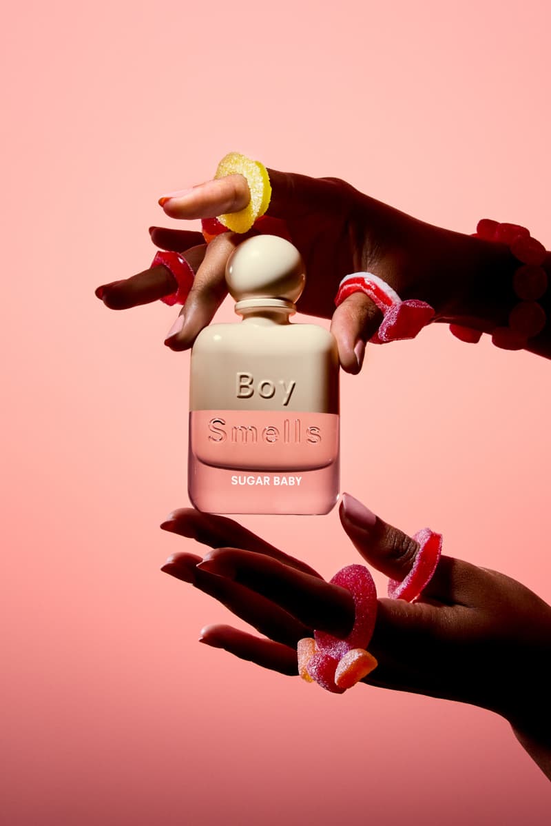 woman holding boy smells fragrance in white skirt, new rebrand, candles, beauty