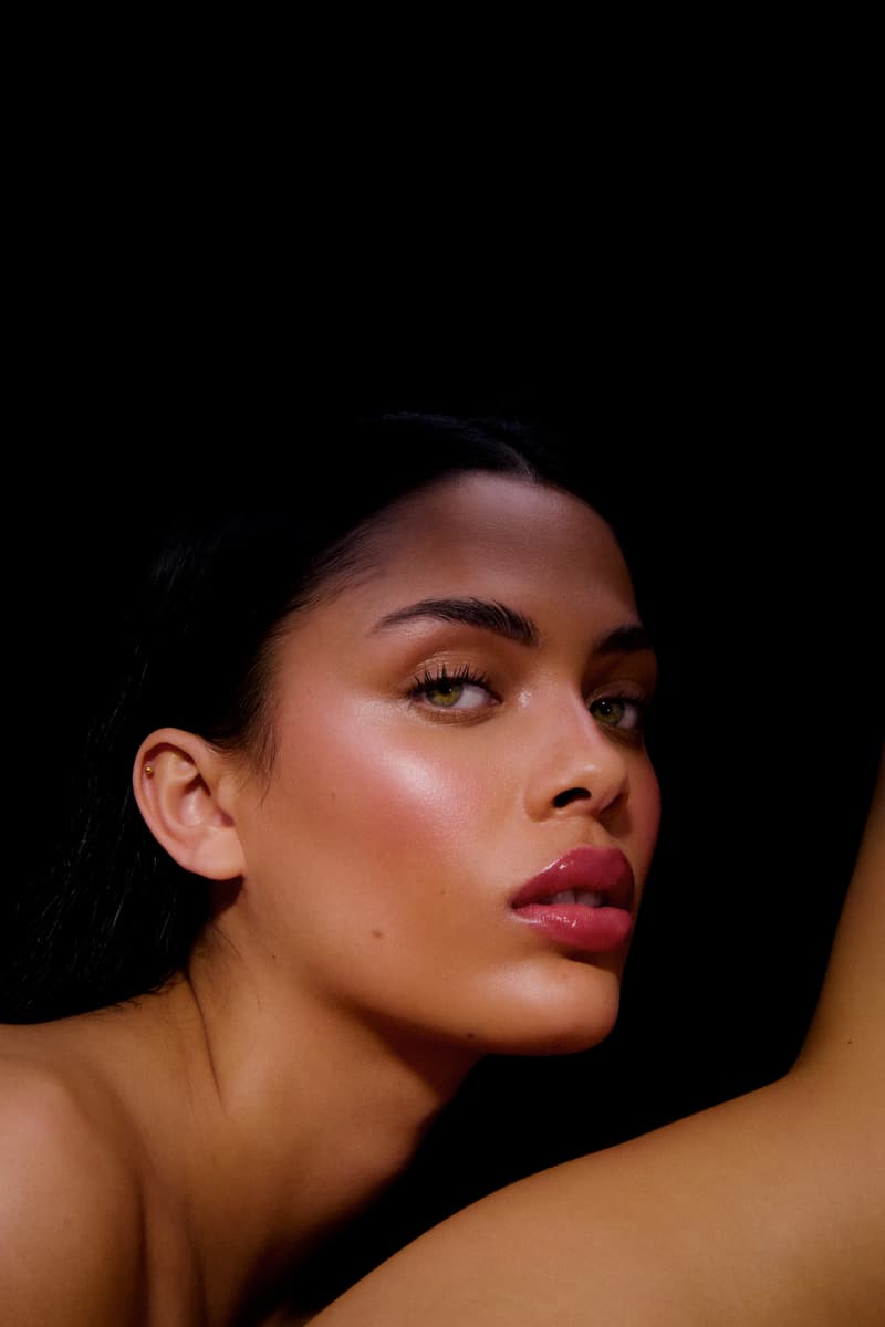 woman laying down next to the new les filles en rouje la charme palette, new makeup, french beauty