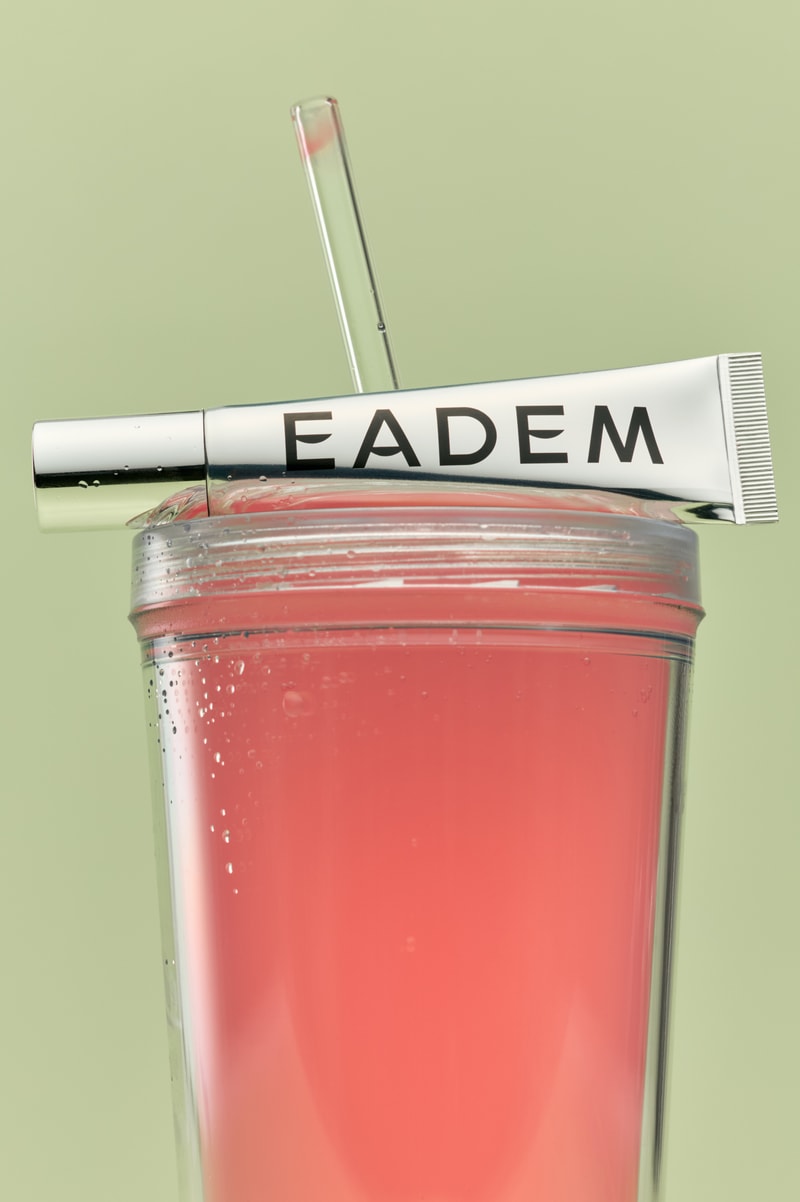 woman licking lollipop, eadem chou chou lip balm in guava fresca skincare makeup beauty