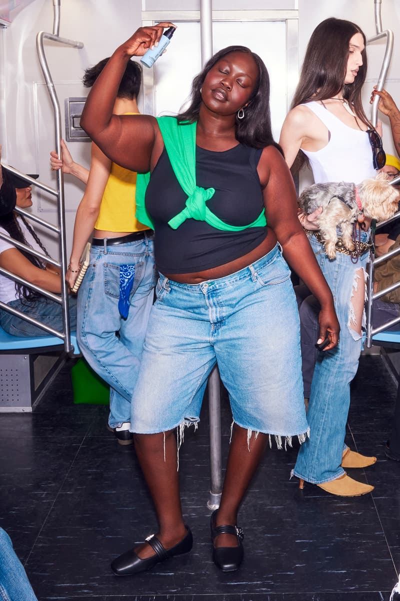 woman in the subway spraying skincare mist on her face, sofie pavitt skincare, beauty 