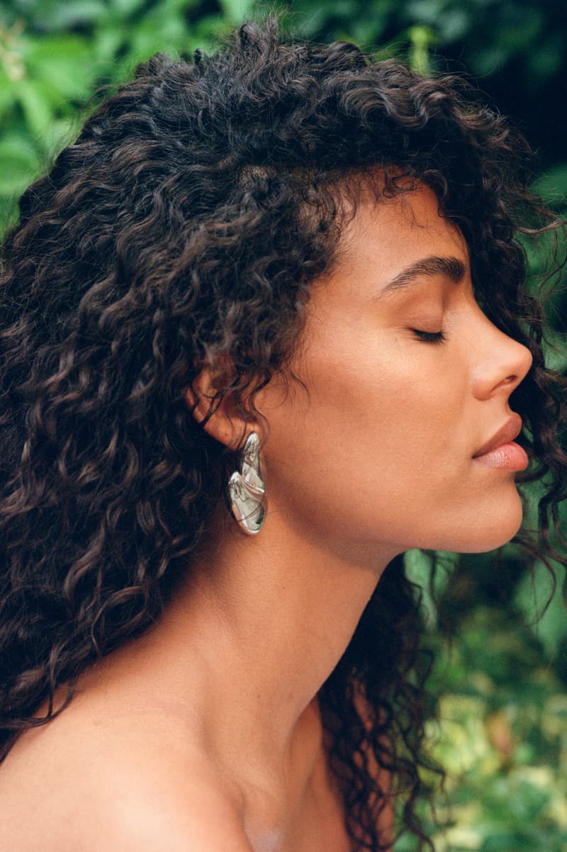 tina kunakey posing with her side profile, emma lewisham sunscreen, sunceutical collection mineral SPF 50 glow serum, skincare, beauty