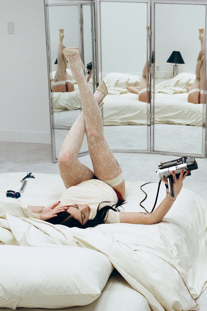 julia fox posing with mienne products on white bed, luxury skincare brand