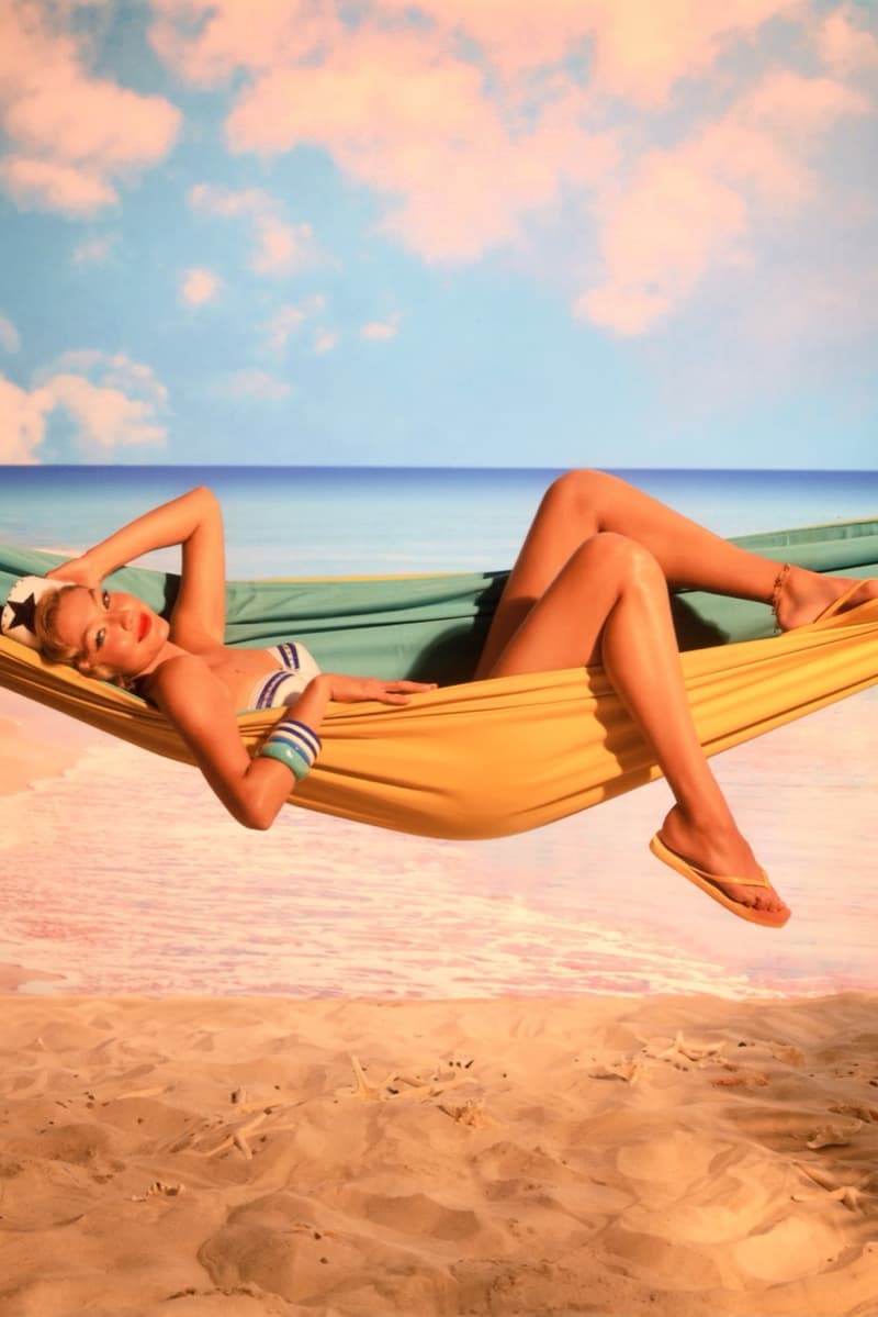 gigi hadid, havaianas, sailor hat, woman, flip flops, pants, beach, hammock