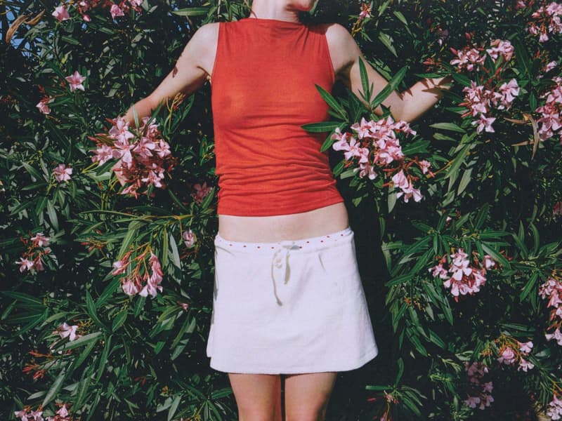 fruity booty, swimwear, bikinis, fish prints, sea, woman, girl, lying down, on the beach