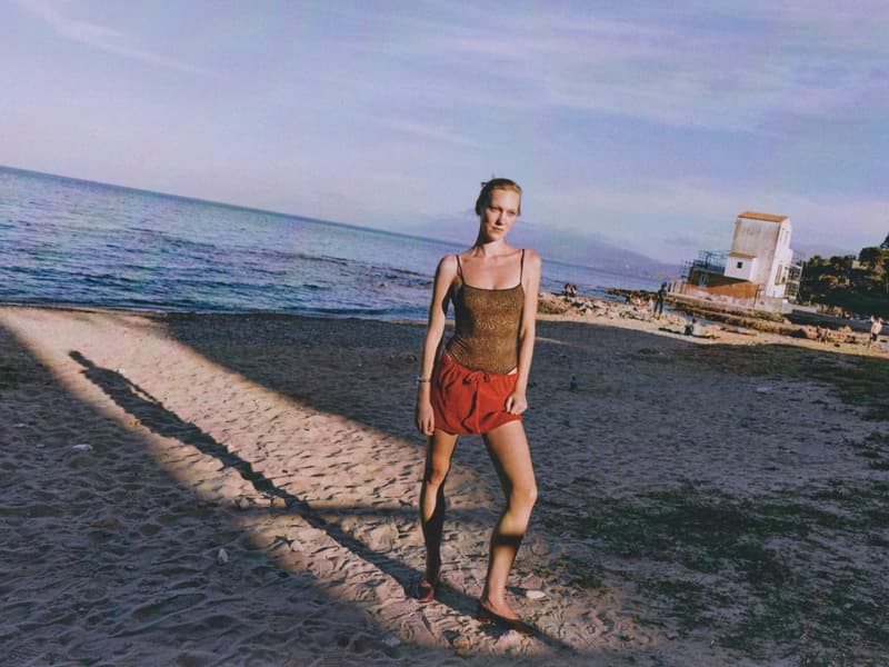 fruity booty, swimwear, bikinis, fish prints, sea, woman, girl, lying down, on the beach