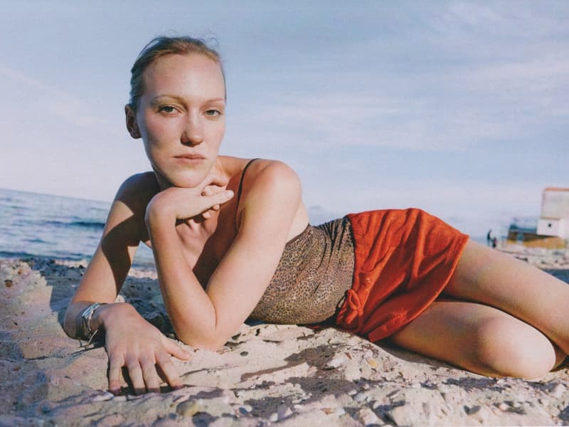 fruity booty, swimwear, bikinis, fish prints, sea, woman, girl, lying down, on the beach