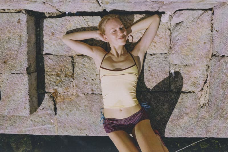 fruity booty, swimwear, bikinis, fish prints, sea, woman, girl, lying down, on the beach