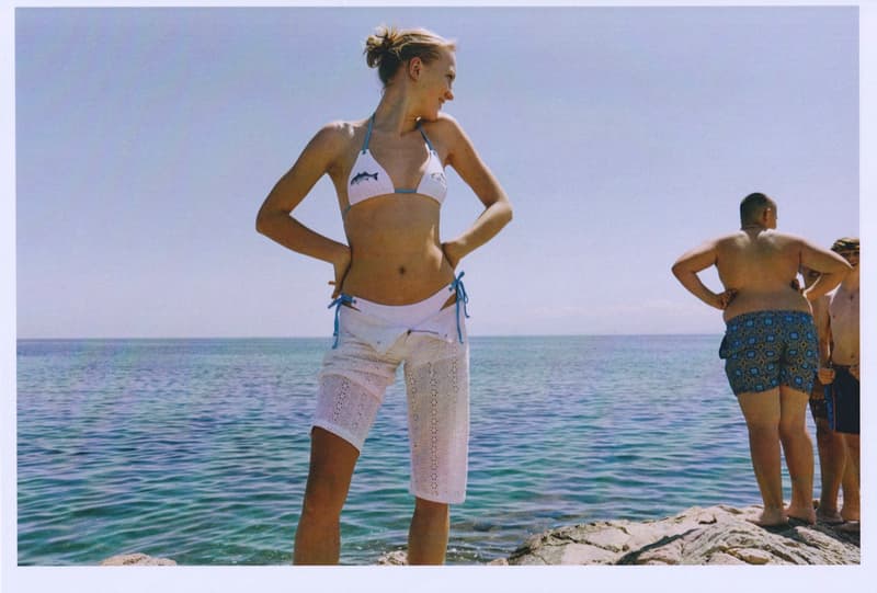 fruity booty, swimwear, bikinis, fish prints, sea, woman, girl, lying down, on the beach