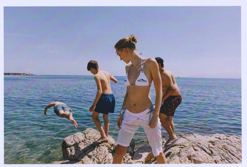 fruity booty, swimwear, bikinis, fish prints, sea, woman, girl, lying down, on the beach