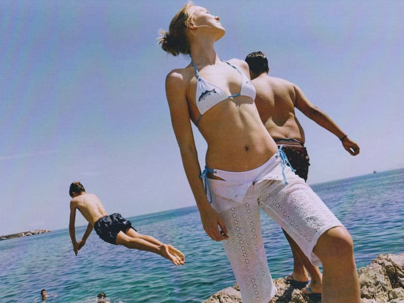 fruity booty, swimwear, bikinis, fish prints, sea, woman, girl, lying down, on the beach