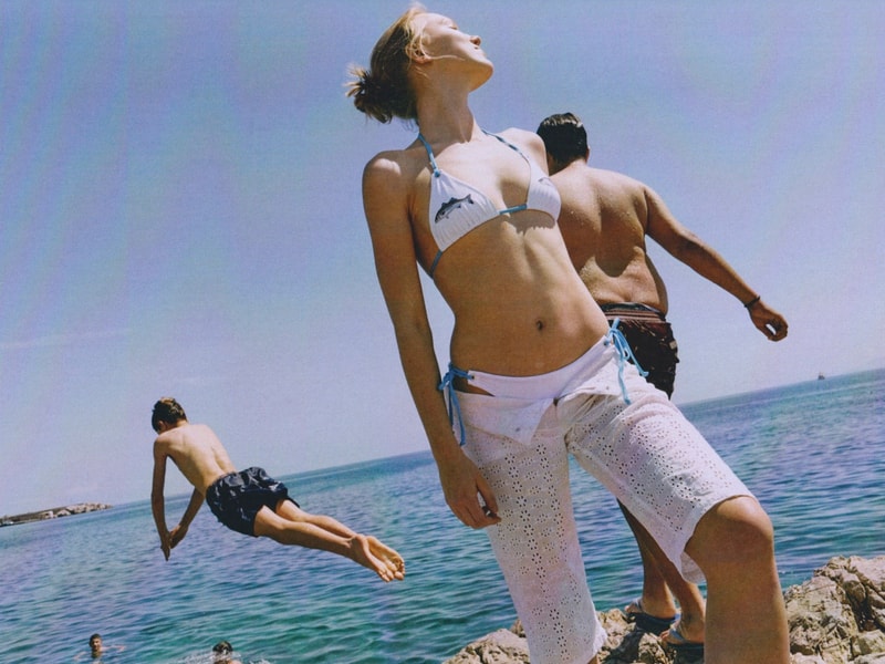 fruity booty, swimwear, bikinis, fish prints, sea, woman, girl, lying down, on the beach
