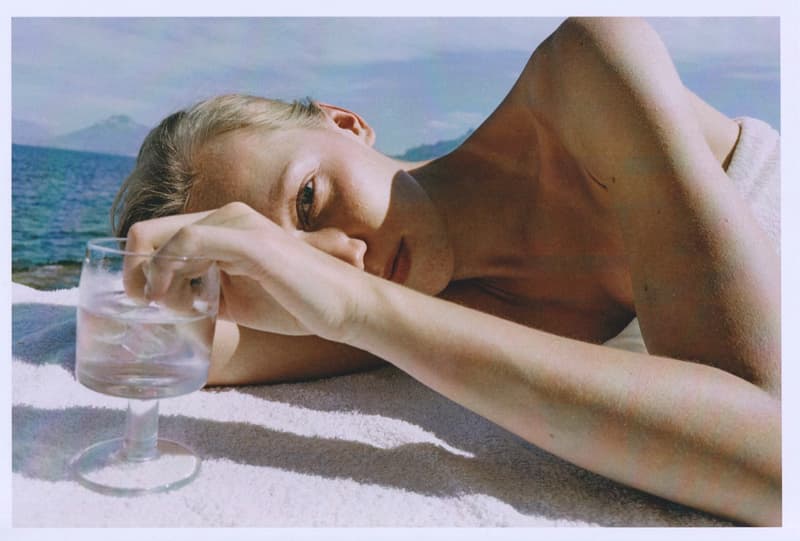 fruity booty, swimwear, bikinis, fish prints, sea, woman, girl, lying down, on the beach