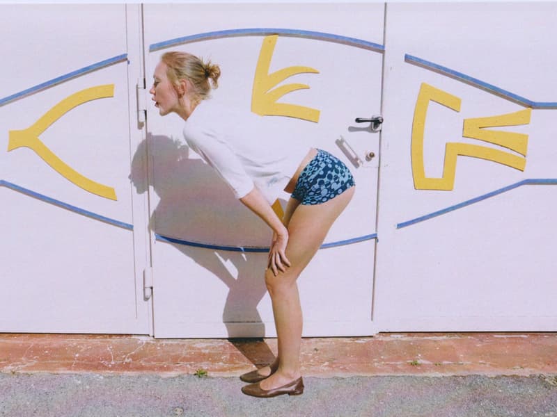 fruity booty, swimwear, bikinis, fish prints, sea, woman, girl, lying down, on the beach