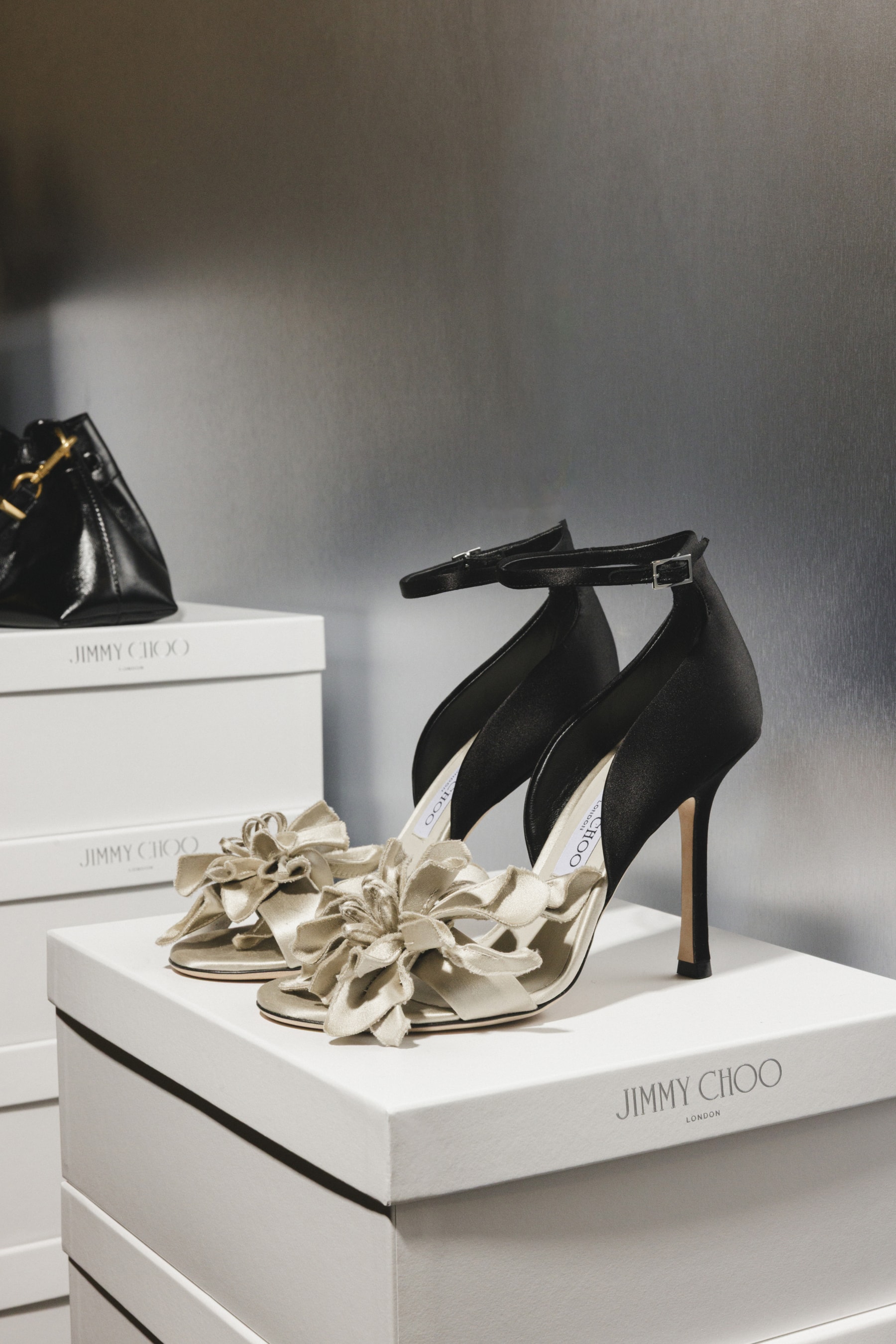jimmy choo, lace heels, design studio, milan, boots, bags, leather