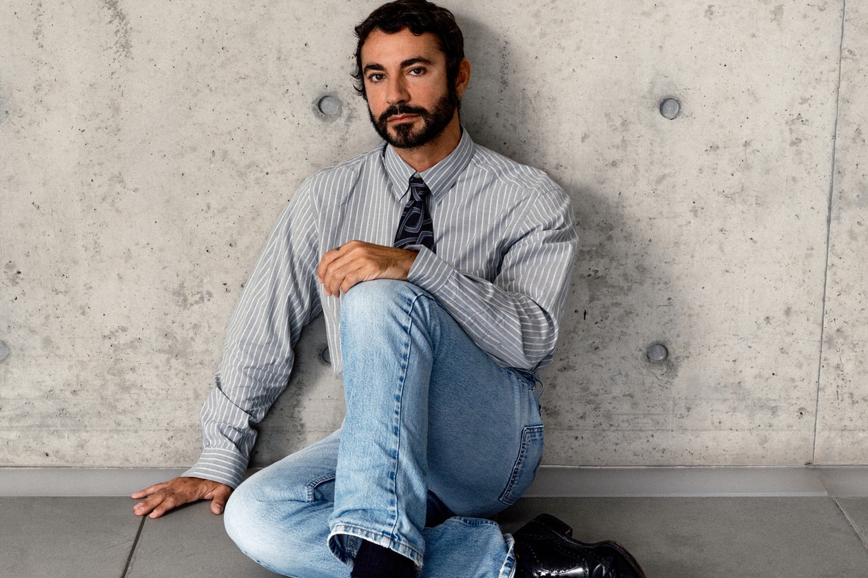 dario vitale, man, shirt, tie, jeans, sitting, white wall background