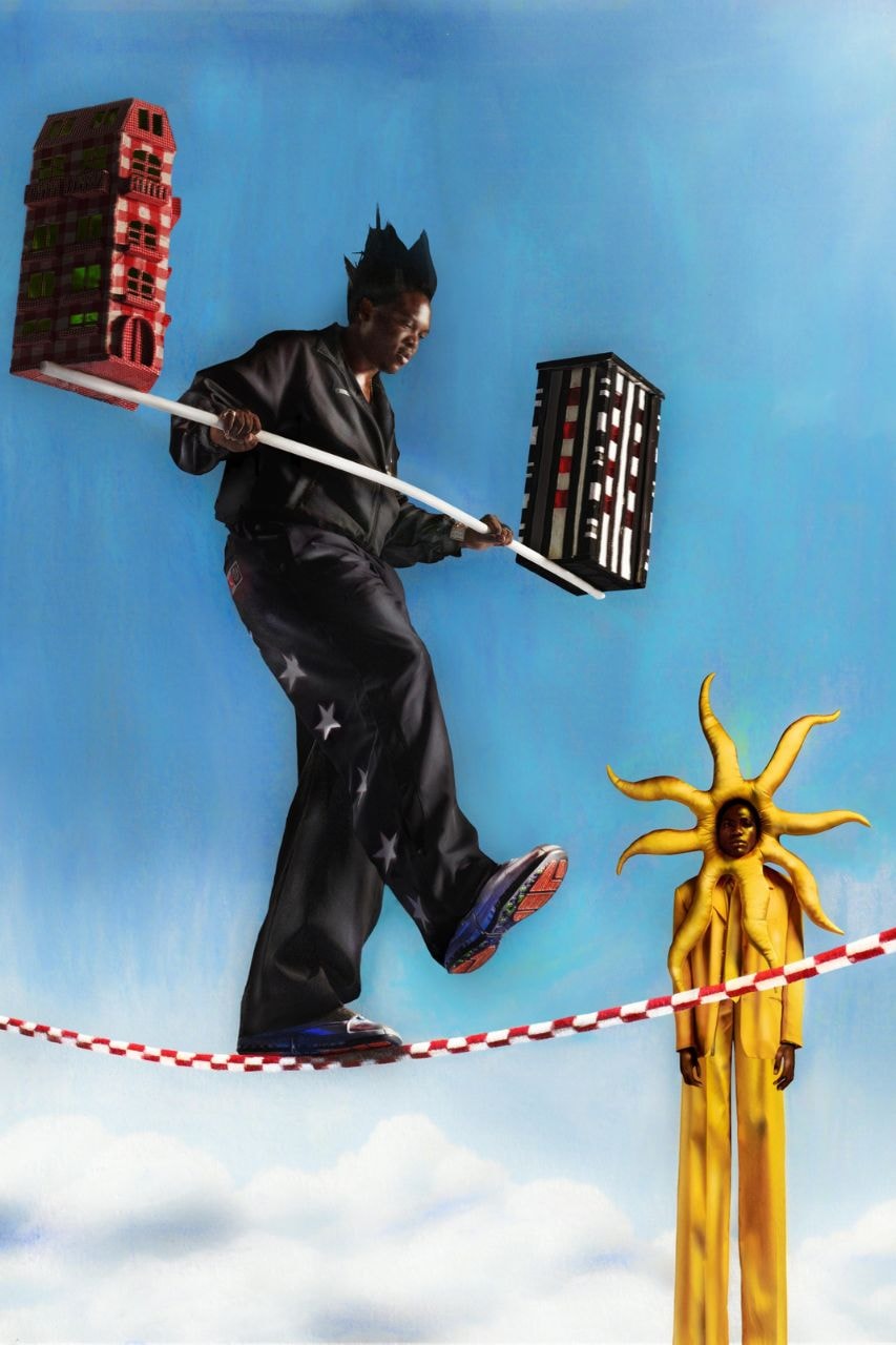 Free The Youth performer balancing buildings on a tightrope in the Jordan campaign