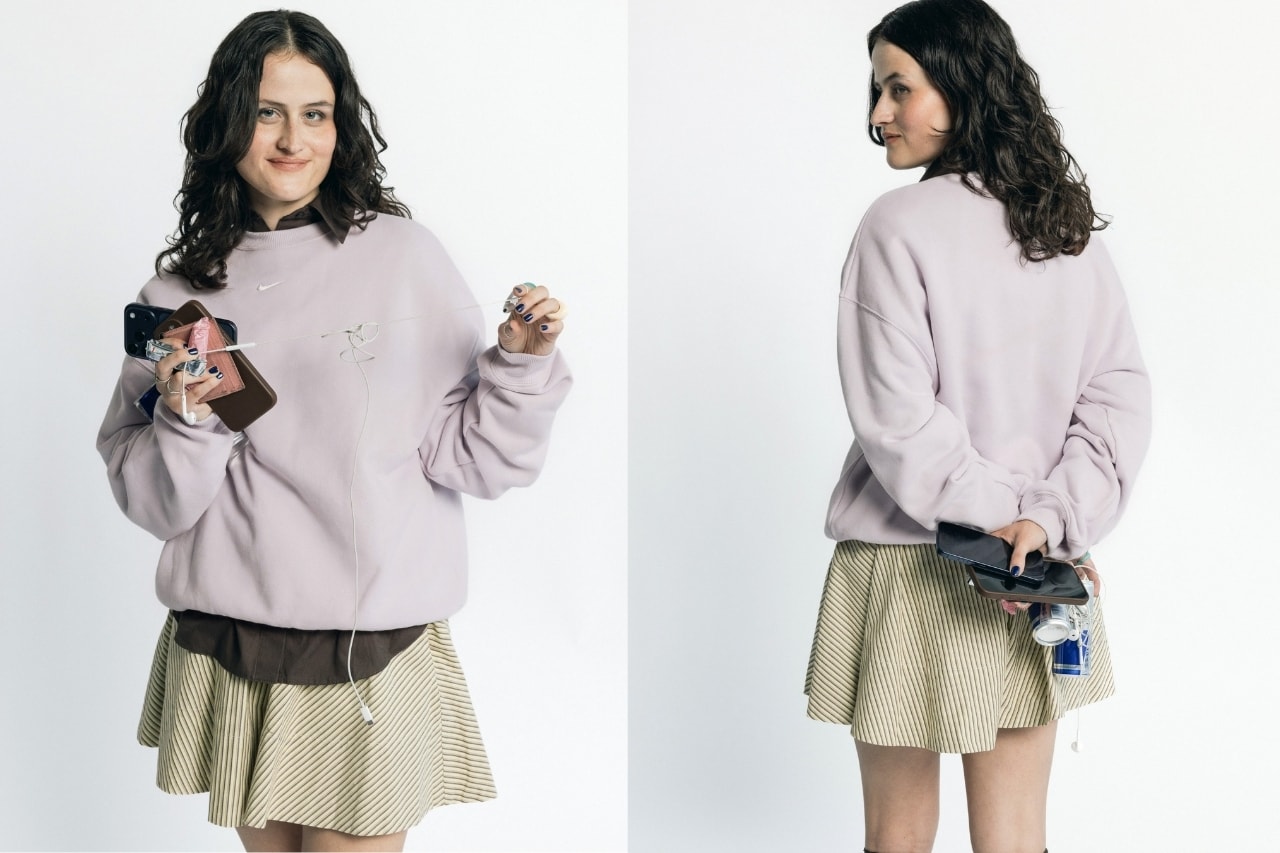 girls carrying things, girl grip, nike studio fleece, creatives, wired headphones, phone