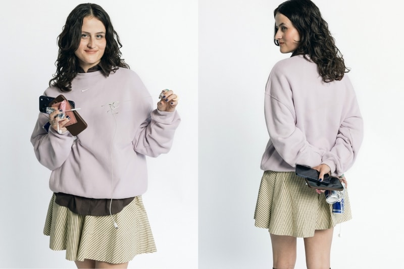 girls carrying things, girl grip, nike studio fleece, creatives, wired headphones, phone