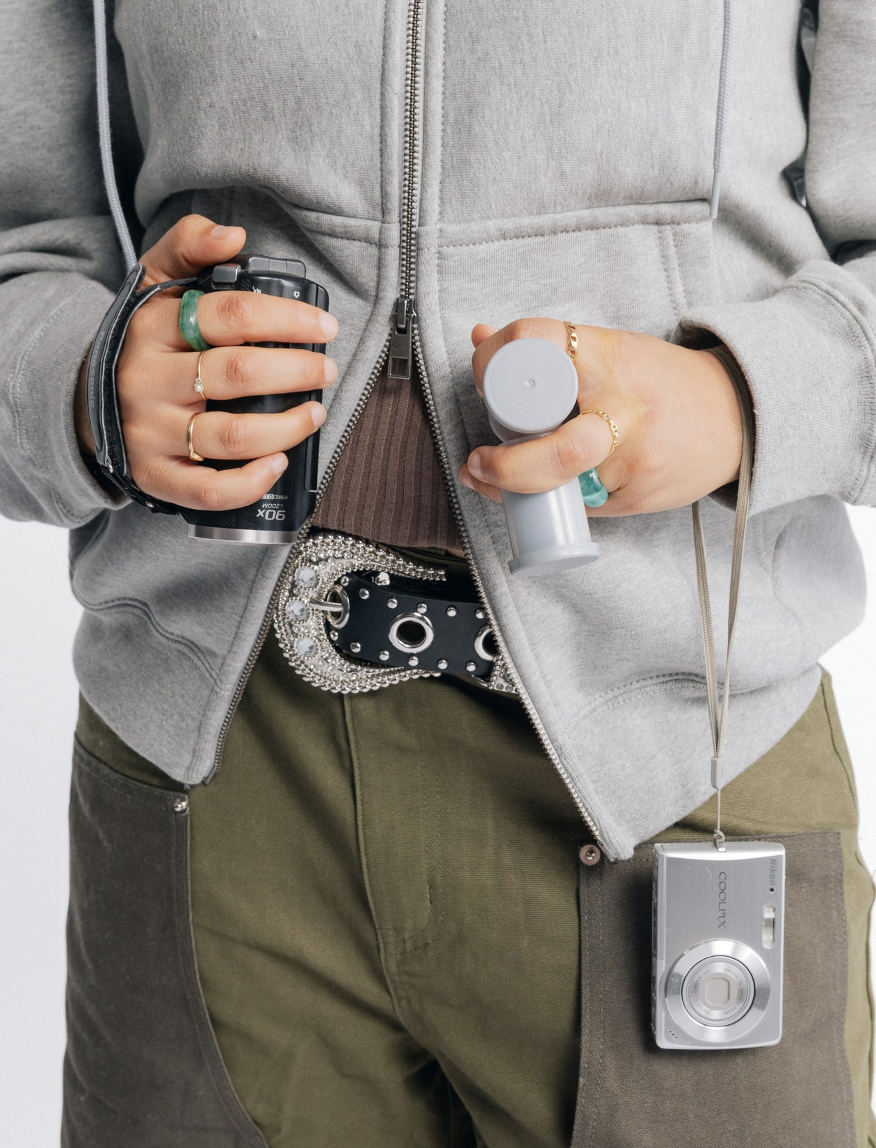girls carrying things, girl grip, nike studio fleece, creatives, wired headphones, phone