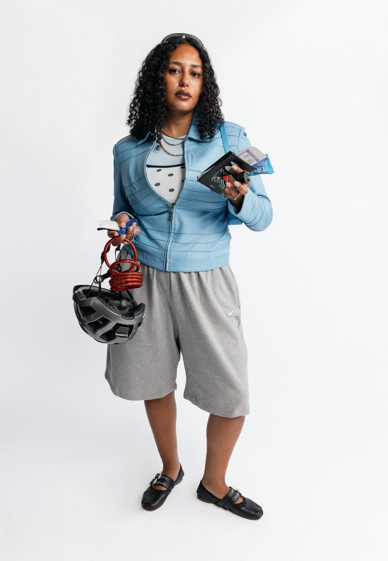 girls carrying things, girl grip, nike studio fleece, creatives, wired headphones, phone