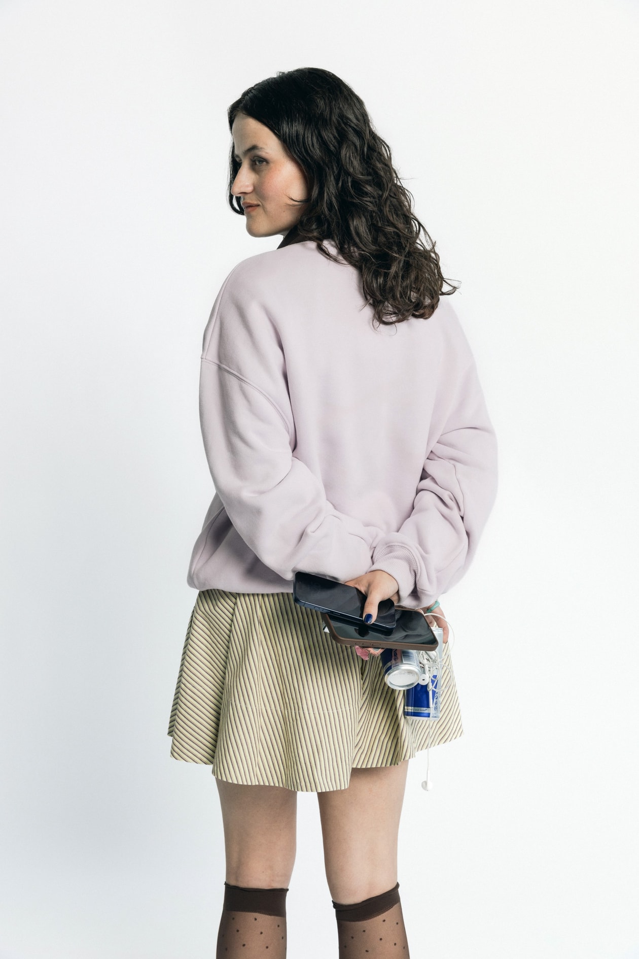 girls carrying things, girl grip, nike studio fleece, creatives, wired headphones, phone
