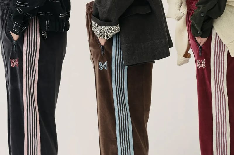 Calça Track de Veludo JOURNAL STANDARD x NEEDLES SS26 leva a elegância urbana a outro nível