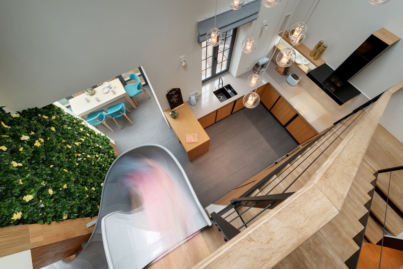 ki design studio was designed an apartment with slide