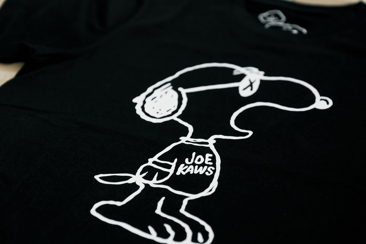 Collaboration KAWS x Uniqlo Ut Inspiration Snoopy Peanuts
