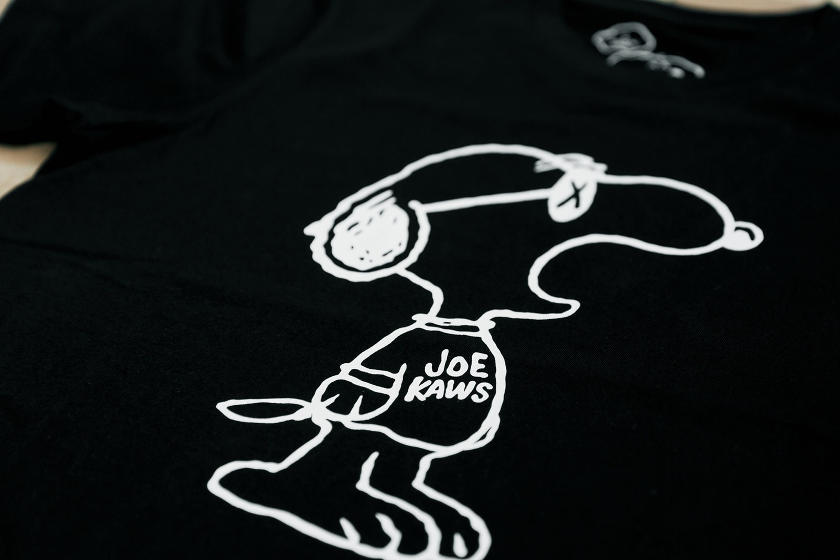 Collaboration KAWS x Uniqlo Ut Inspiration Snoopy Peanuts