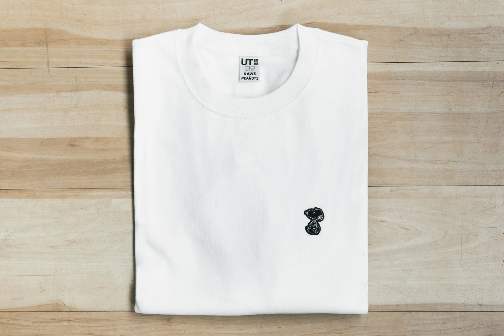 Collaboration KAWS x Uniqlo Ut Inspiration Snoopy Peanuts