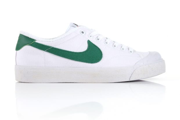 white and green nike shoes