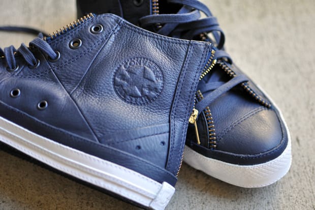 navy blue leather chuck taylors
