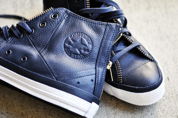 navy blue leather chuck taylors