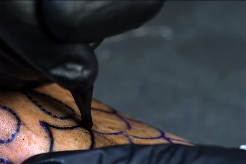 A Mesmerizing Video of a Tattoo Gun in Slow Motion