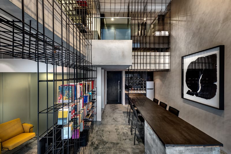 A Look Inside the Singapore Loft Unified by a Giant Cage