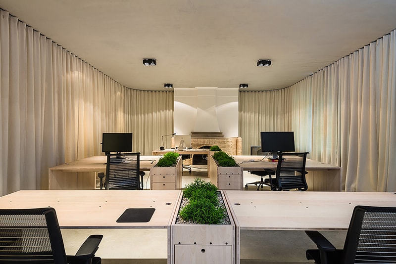 Dekleva Gregoric Architects Uses Curtains to Create Rooms in This Office Design