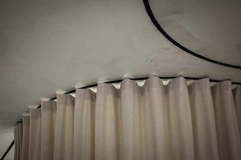 Dekleva Gregoric Architects Uses Curtains to Create Rooms in This Office Design
