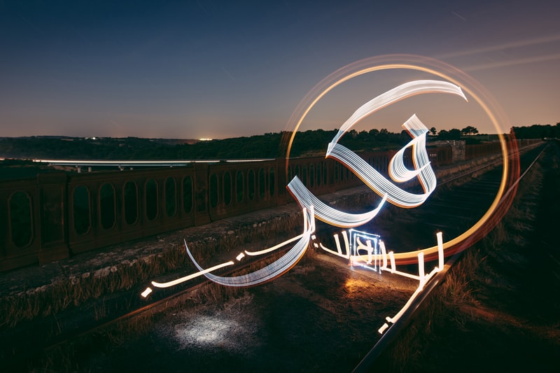 Artist Julien Breton Paints Light Calligraphy Around the World