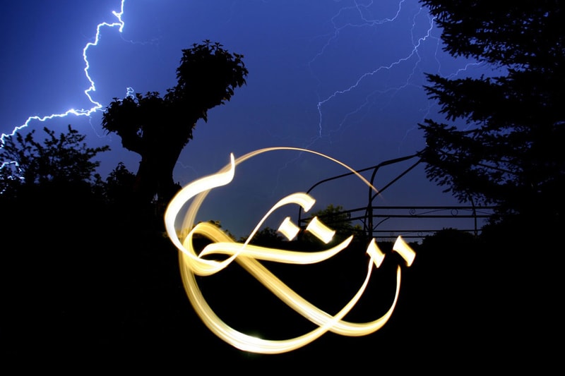 Artist Julien Breton Paints Light Calligraphy Around the World