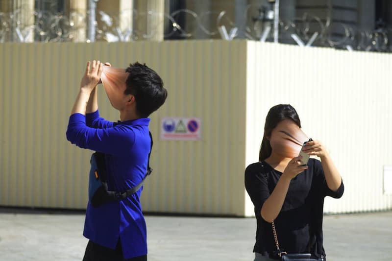 Photographer Portrays Faces Being Absorbed By Smartphones