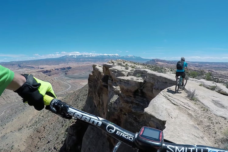 Watch These Daredevils Mountain Bike Along a 400-Foot Cliff