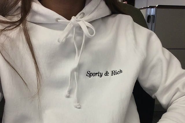 Emily Oberg Calls Out Forever 21 For Plagiarizing Sporty & Rich Merch