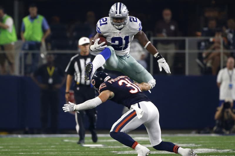 ezekiel elliott dallas cowboys hurdle jump over defender chicago bears nfl football