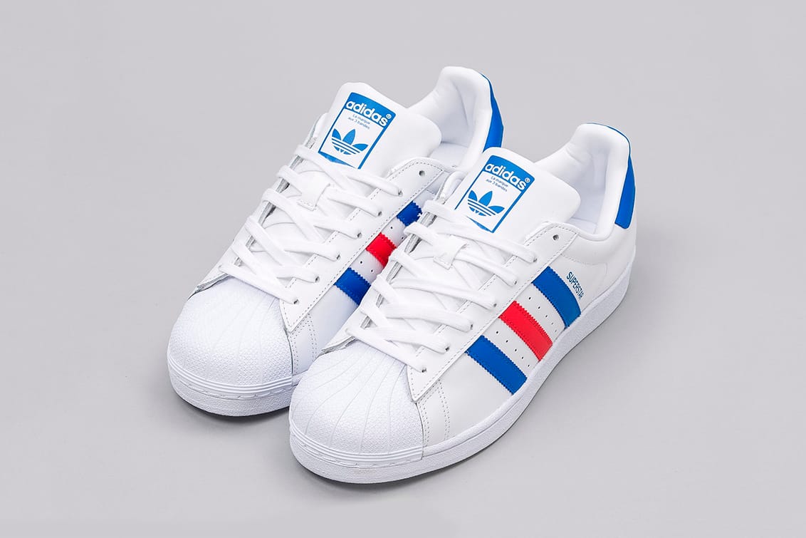 adidas shoes white with blue stripes 