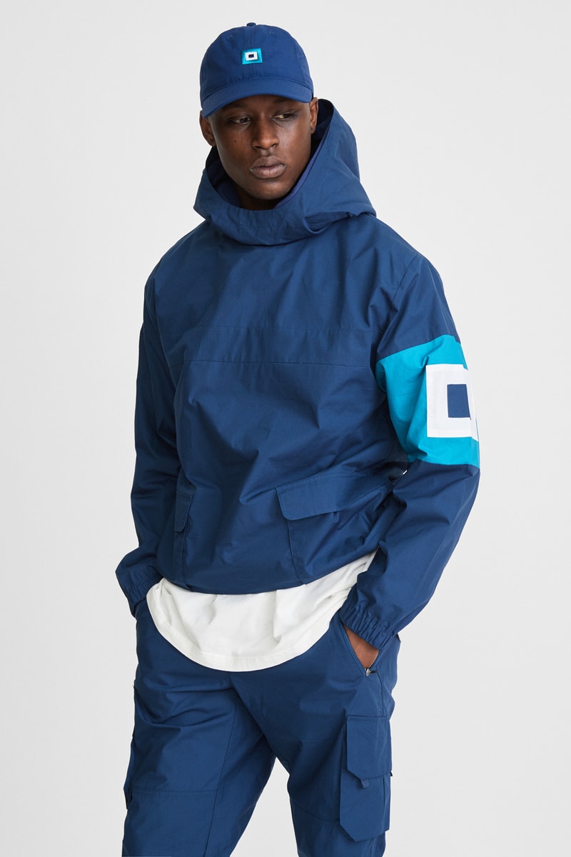 KITH x Aimé Leon Dore Mykonos Collaboration Navy Nammos Pullover Sailing Jacket Front Evil Eye Cap Front