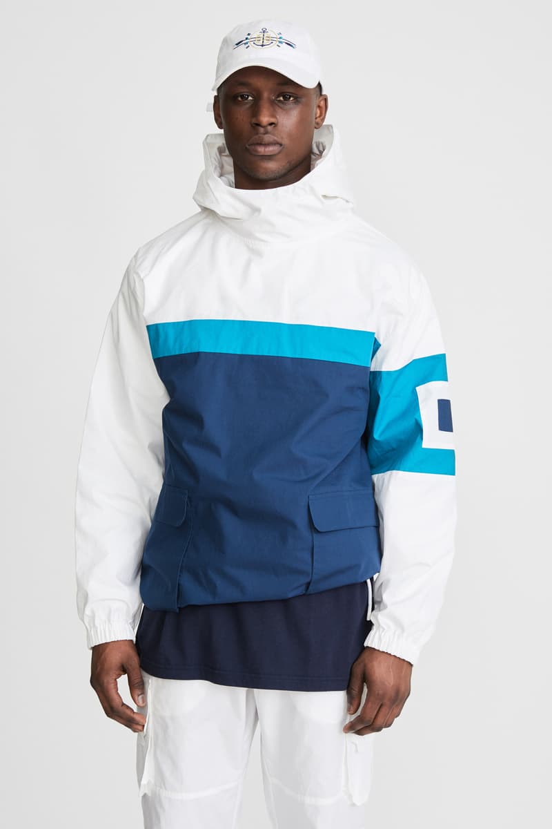 KITH x Aimé Leon Dore Mykonos Collaboration White Nammos Pullover Sailing Jacket Front White Anchor Logo Cap Front