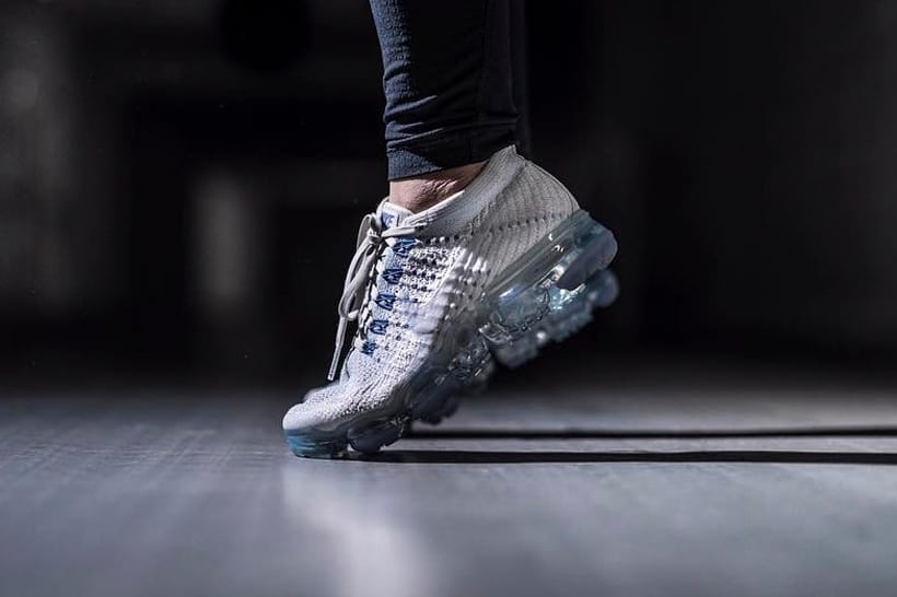 white vapormax with blue bottom